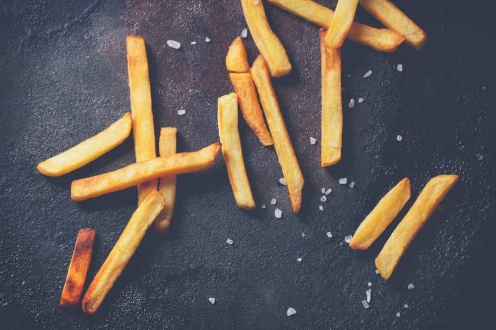 Salt and Seasonings onto Fries